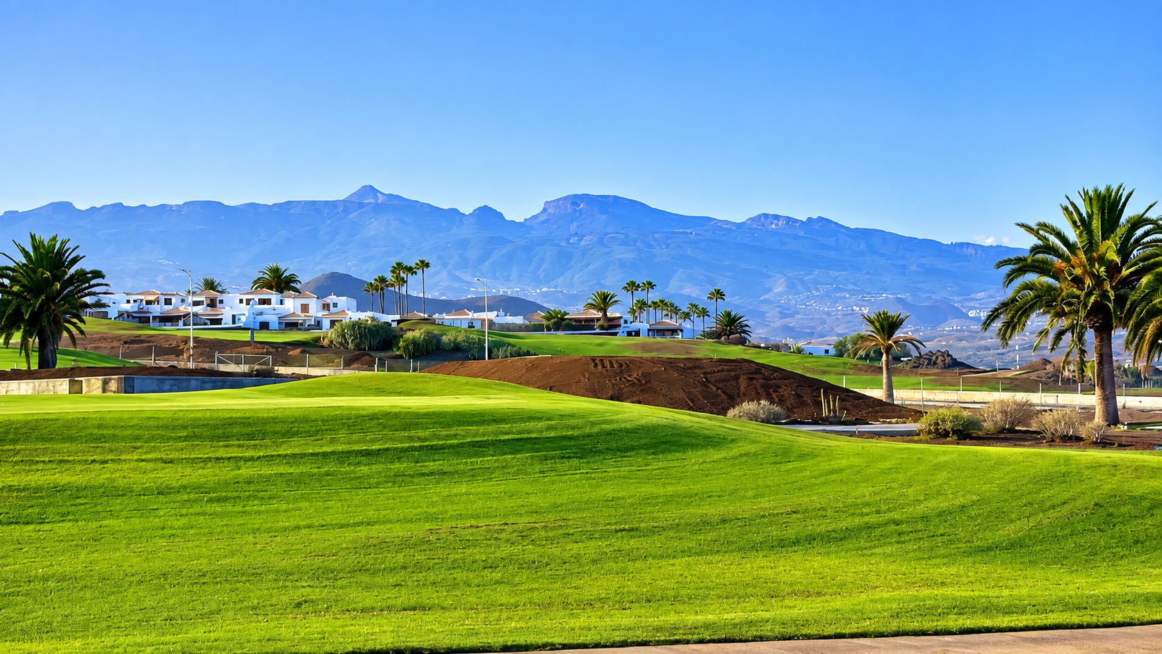 Golf course in south Tenerife with palm trees and Atlantic Ocean views